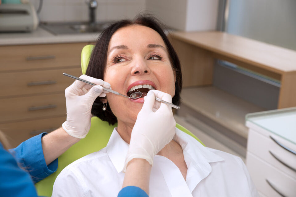 Middle-aged woman gets a dental cleaning and checkup