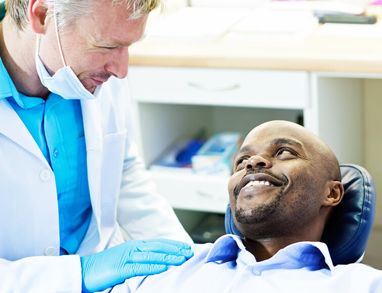 dentist comforting a patient