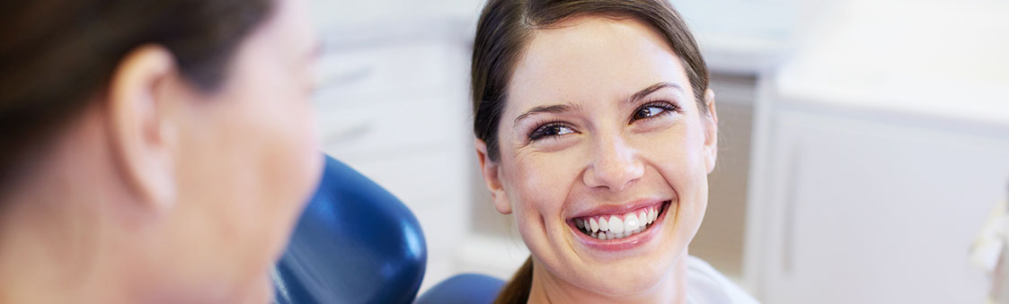 smiling woman sitting in a dental chair in jonesboro
