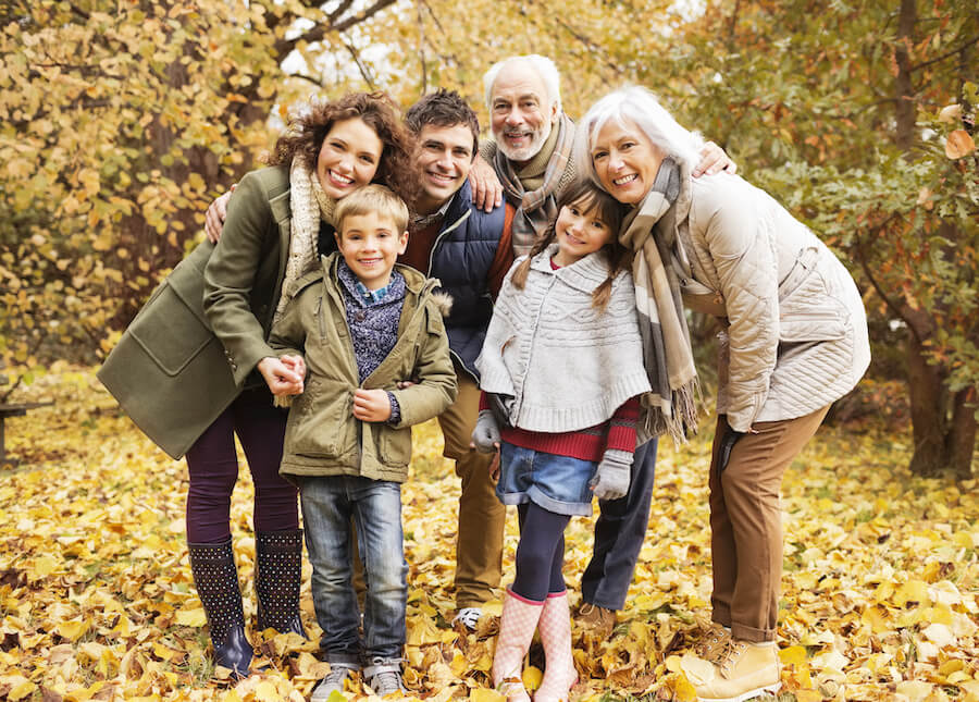 Family in a park during fall all smiling together in jonesboro