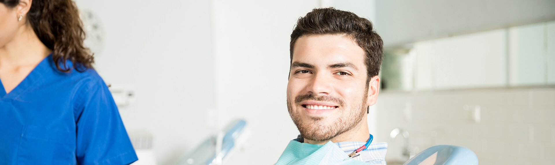 smiling man sitting in a dental chair in jonesboro