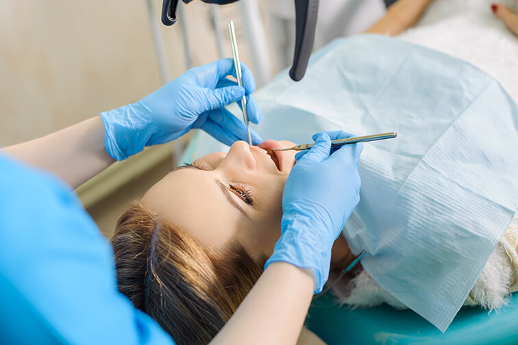 woman receiving a dental exam