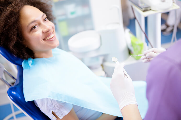 woman who is about to receive a dental exam
