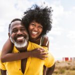 smiling couple with white teeth from teeth whitening