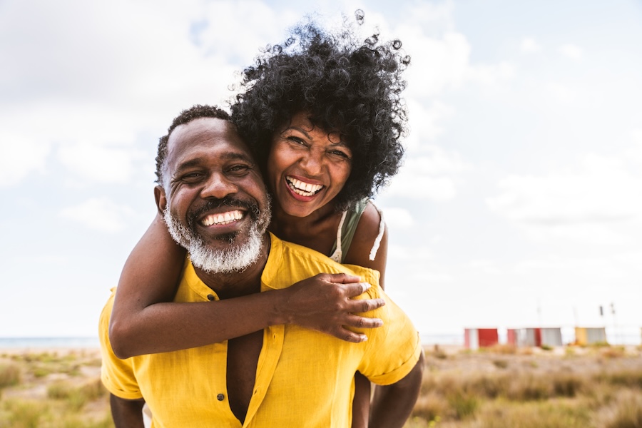 smiling couple with white teeth from teeth whitening